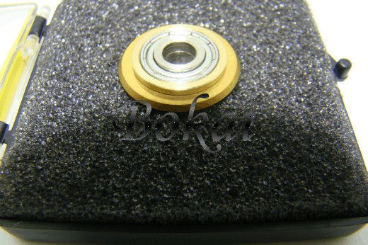 Manual ceramic tile cutting machine with a roller bearing a knife wheel with a knife wheel with a knife wheel