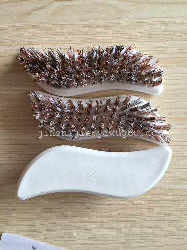 s-shaped white plastic brush