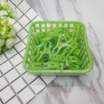 With a basket of plastic clips
