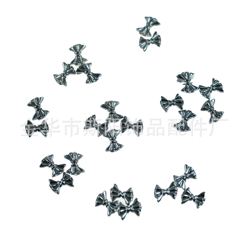 义乌批发烤漆穿线花型蝴蝶结散珠 服装配件 厂家直销现货供应
