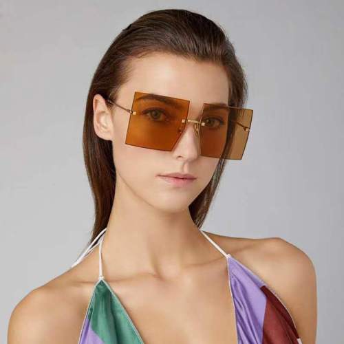 European and American Elegant Frameless Trimming Sunglasses Star Fashion Women‘s Street Shot Face-Covering Sunglasses 9051