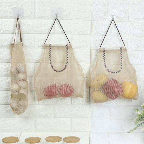 kitchen wall hanging fruit and vegetable storage bag portable ginger and garlic hollow mesh bag breathable fruit storage bag wholesale