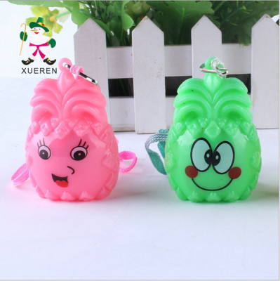 Factory direct selling pineapple stall cute smile flash pendant flash toy wholesale