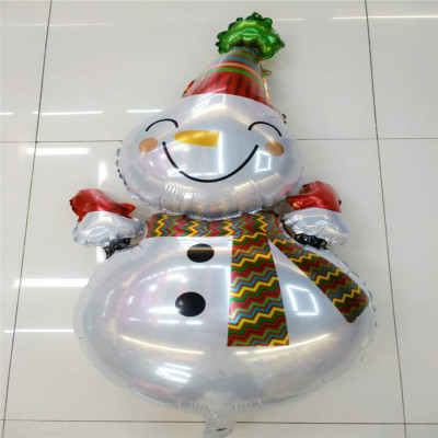 A smiling snowman decorated with aluminum balloons for Christmas