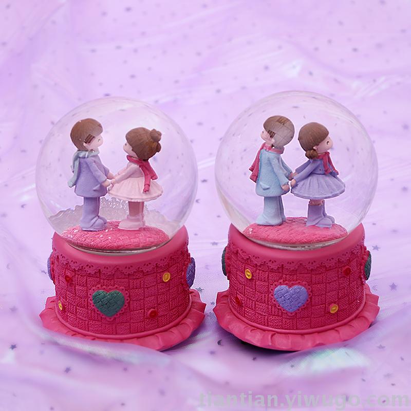 The whole family has excellent presents a couple holding hands with a crystal ball music box dreamli